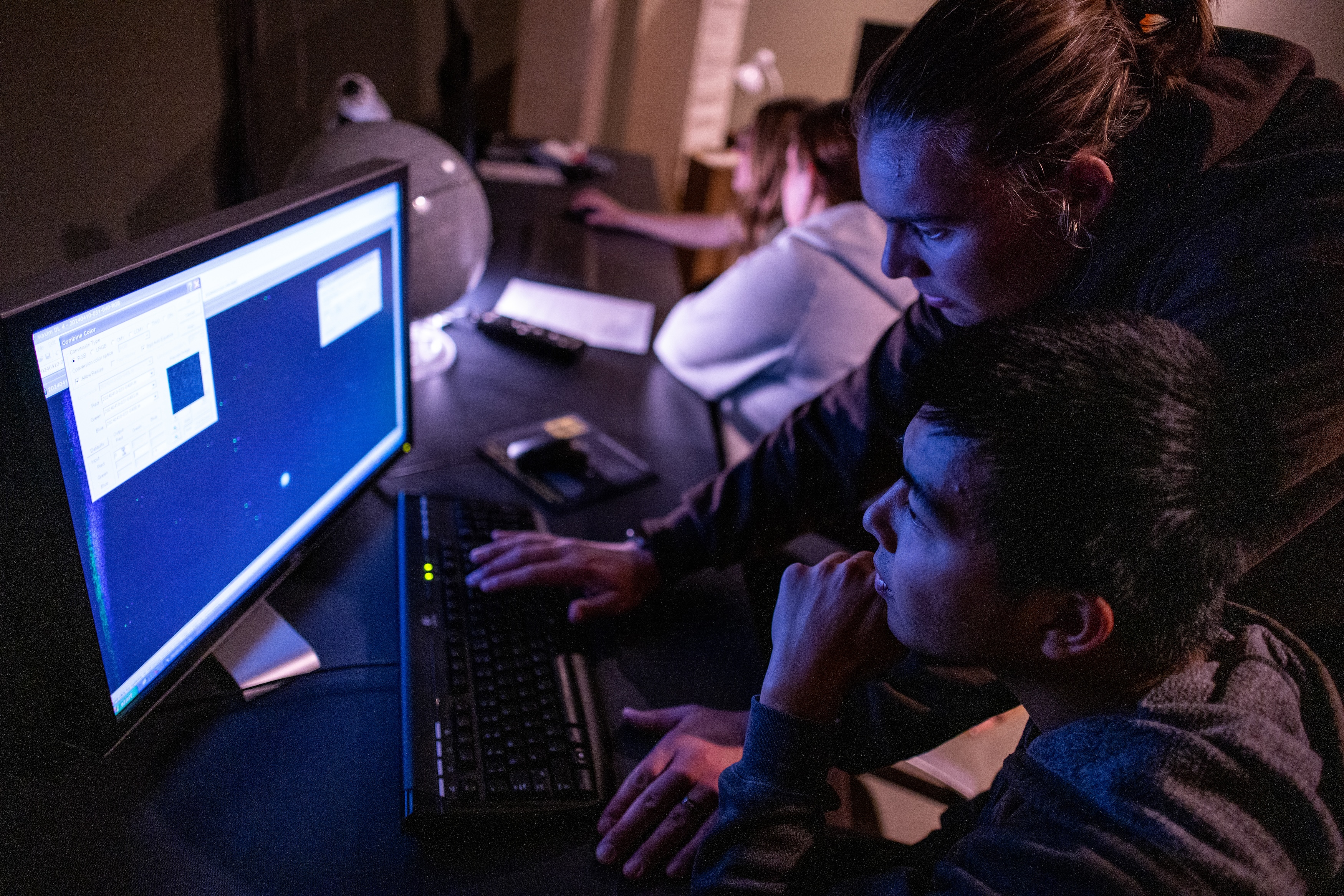 students looking at data on computer