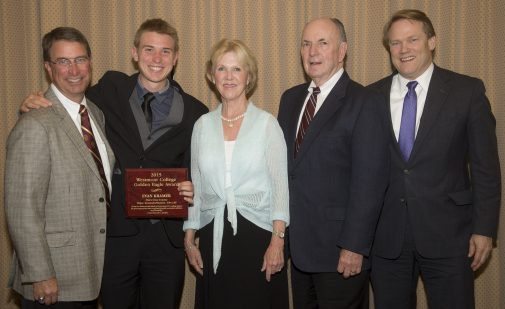 Evan Kramer with coach Russell Smelley, the Jordano's and President Beebe