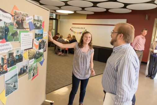 Student Heather Chmura explains her "One Big Idea" to professor Steven Contakes