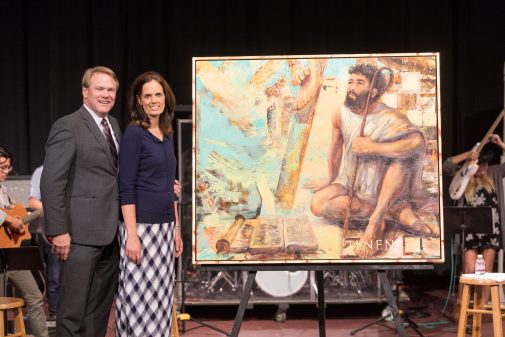 Gayle and Pam Beebe pose with the painting after chapel